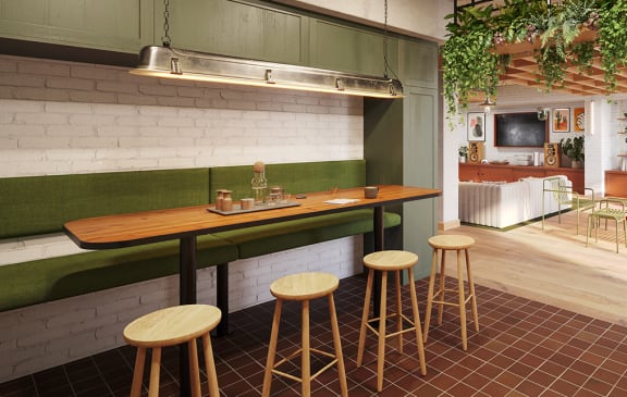 a kitchen with a long counter and bar stools