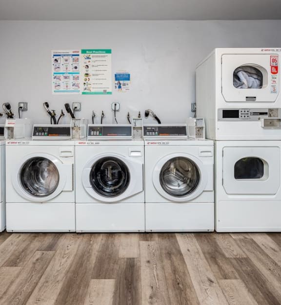 a row of washing machines sitting next to each other