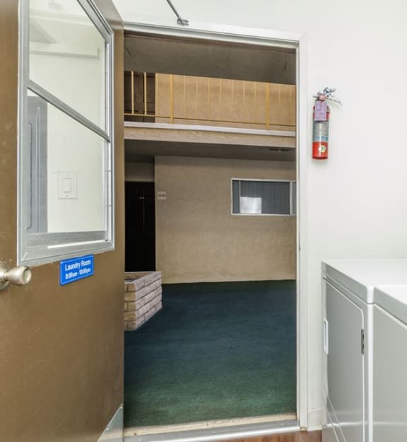 a room with a washer and dryer in it