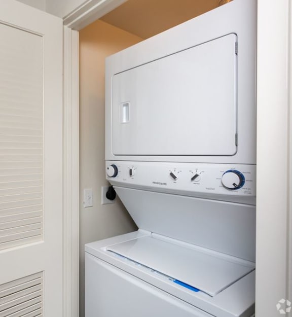 a small laundry room with a washer and dryer