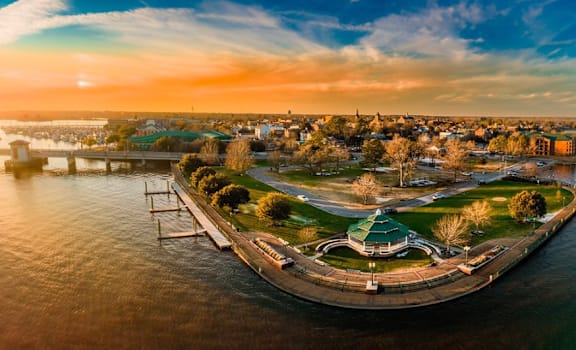 an aerial view of a city with a body of water