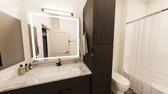 A bathroom with a white sink and a mirror.