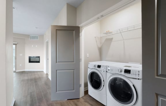a washer and dryer in a laundry room with a door