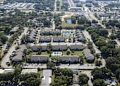 Thumbnail 22 of 23 - This aerial shot shows our gated community with pools and tennis courts.