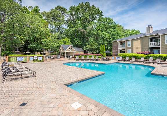 Spacious Pool Sundeck With Brick Pavers & Lounge Chairs