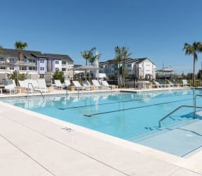 large sundeck and swimming pool with swim lanes at Lake Nona Concorde Apartments in Orlando, FL