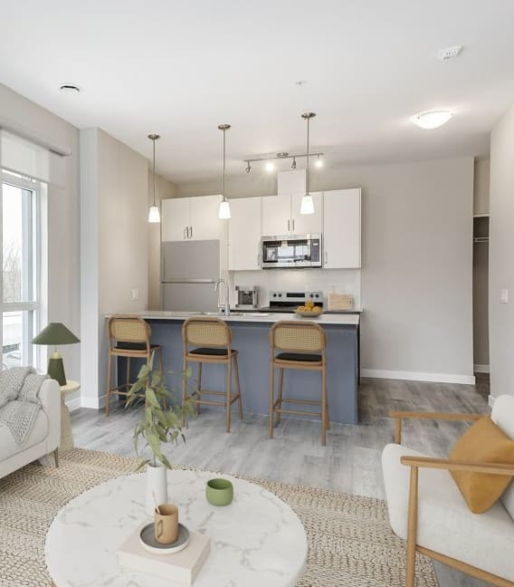 a living room and kitchen with a couch and a table  at 101 Base Line Road West, London, Ontario