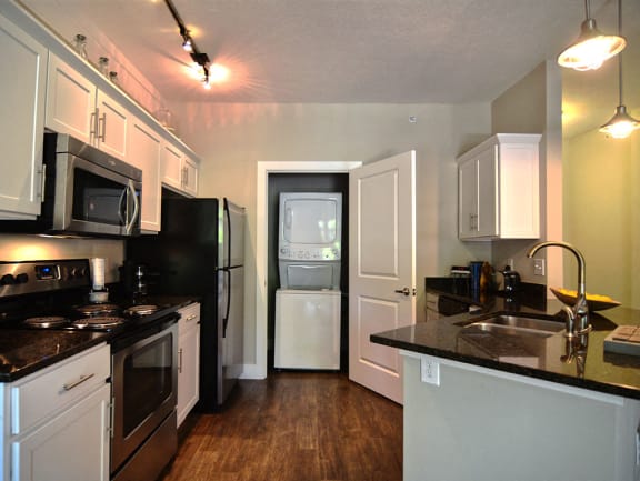 Kitchen and washer/dryer at Strathmoor Apartments , Ohio