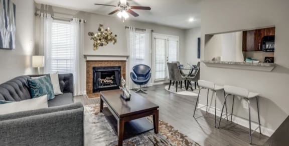 a living room with a fireplace and a sliding glass door
