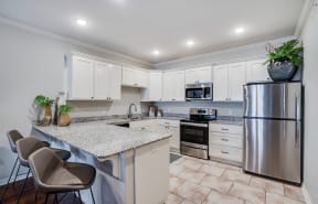 Open Kitchen with White Cabinetry