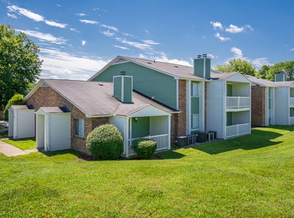 Lush Green Grass in Front of a Rivergate Meadows Apartment Building