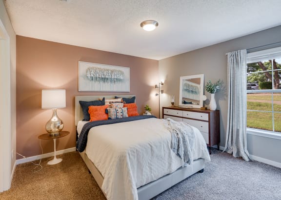 Bedroom with Plush Carpet and Large Window