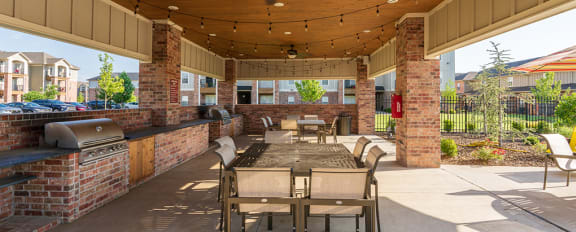 BBQ and Picnic Area with String Lights and Ceiling Fans