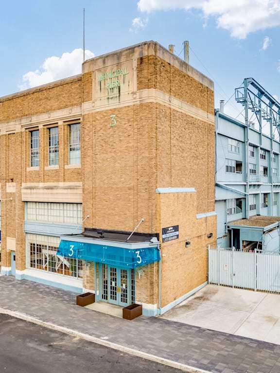 A building with a blue awning and the number 3 on it.