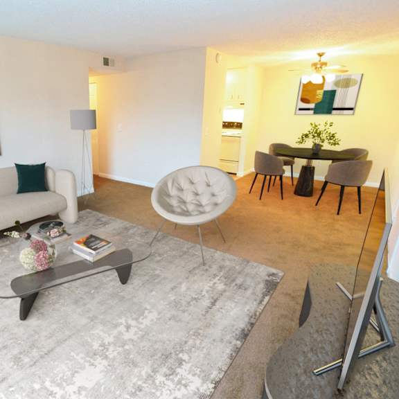 a living room with a couch and a rug