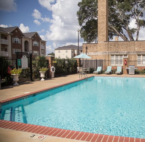 a pool with a building in the background