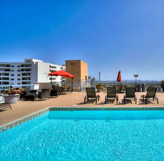 Umbrella Shaded Chairs by Pool at La Vista Terrace, Hollywood, CA, 90046