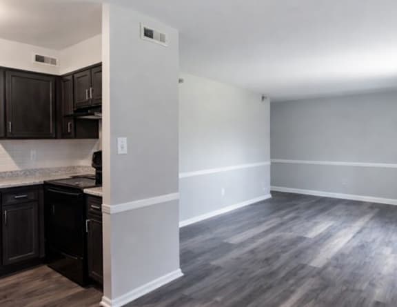 a bedroom with a white bed and a large mirror at Pickwick Farms Apartments, Indianapolis, IN