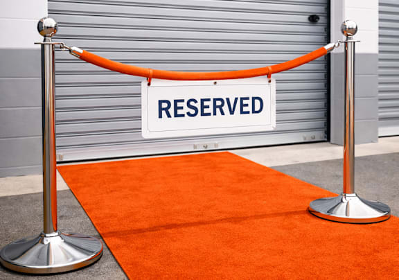 A red carpet leads to a door with a sign that says "RESERVED".