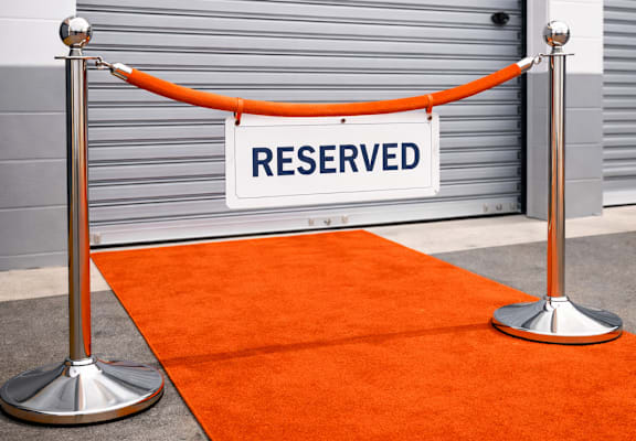 A red carpet leads to a door with a sign that says "RESERVED".