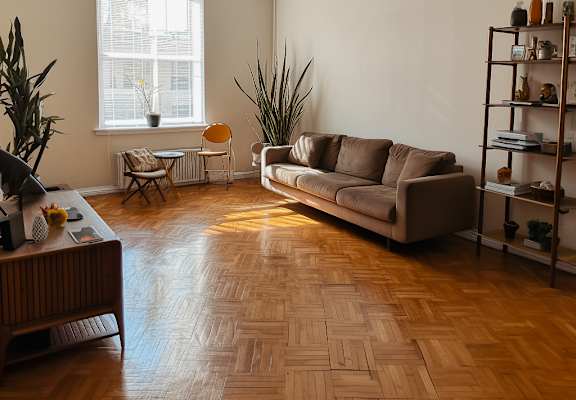 a living room with a couch and a window