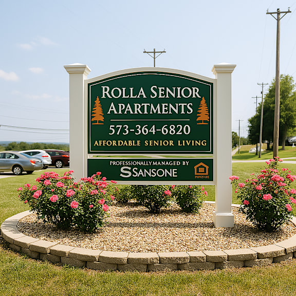A sign for Rolla Senior Apartments with a phone number and a logo for SANSONE.