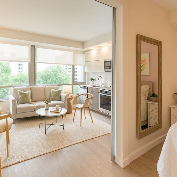 A bedroom with a bed, a couch, and a chair at Artline Apartments, Washington, DC, 20024