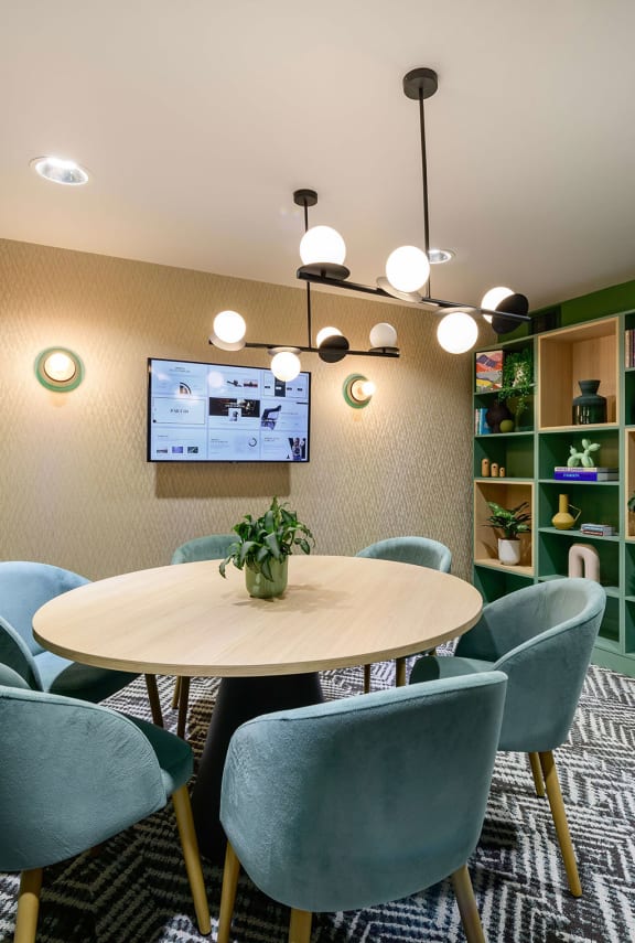 a dining room with a table and chairs
