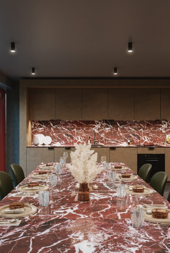 a dining room with a round table and blue chairs