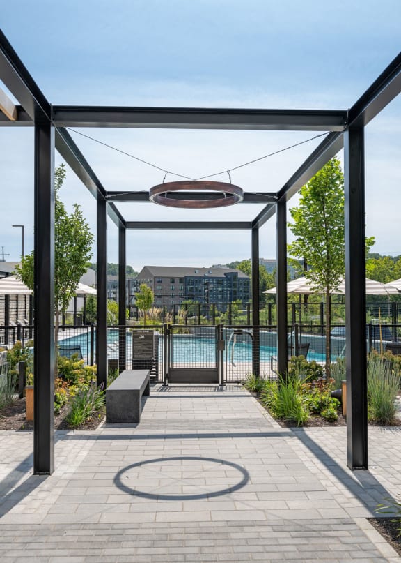 a swimming pool with a building in the background at Madison West Elm, Pennsylvania, 19428