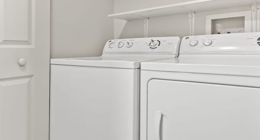the washer and dryer in the laundry room of a home