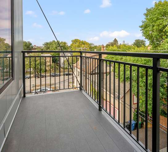 the view from the balcony of a home with a balcony guard rail