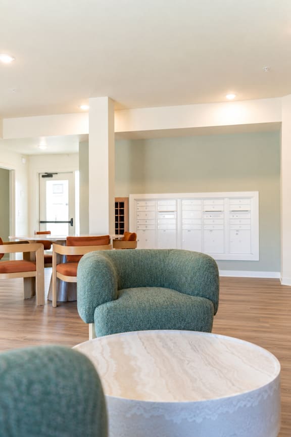 A reception area with a piano and chairs.
