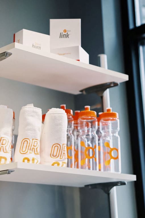 Shelf with Workout Towels and Water Bottles