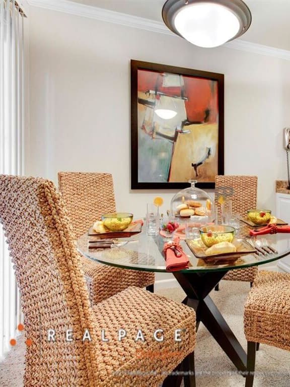 Wicker chairs in dining room, Peninsula Pines Apartments, California