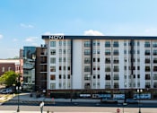 Thumbnail 1 of 9 - A street view of a building with the word NOVI on it.