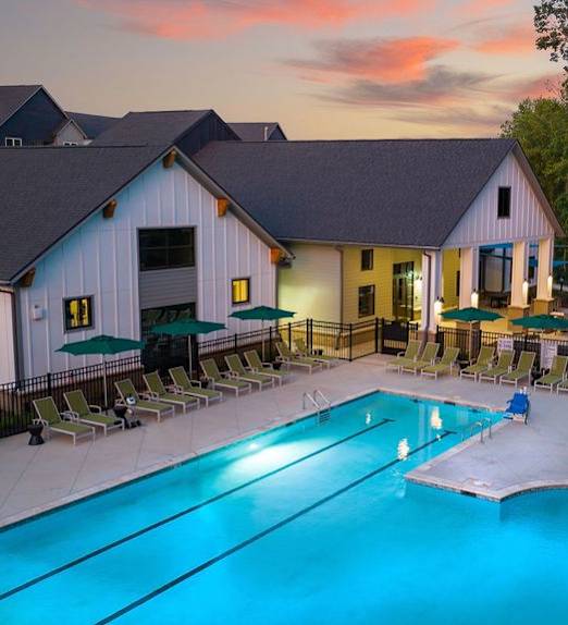 A large house with a pool in the backyard.
