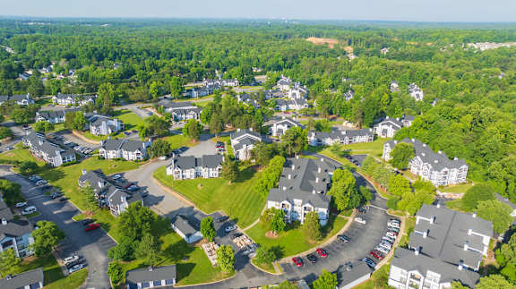 an aerial view of a neighborhood with houses and trees