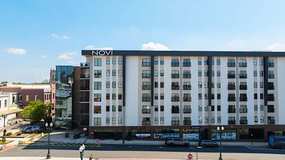 A street view of a building with the word NOVI on it.