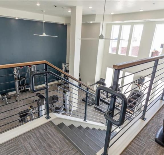 a room with chairs and a metal fence