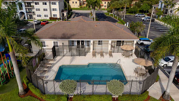 A house with a pool in the backyard.
