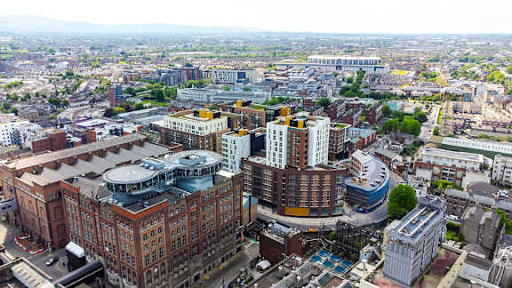 an aerial view of a city with tall buildings