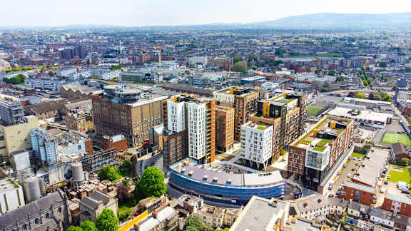 an aerial view of a city with buildings and skyscrapers
