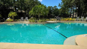 Northlake Apartments Jacksonville, Florida sparkling swimming pool with lounge chairs and additional seating