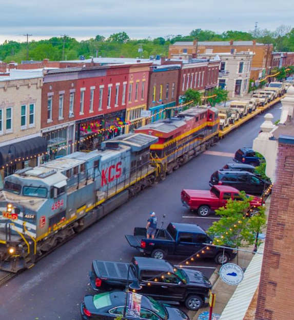 A train is passing through a small town.
