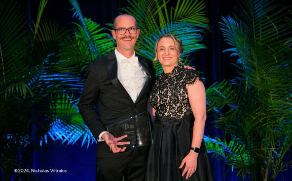 people posing for a photo at an awards event