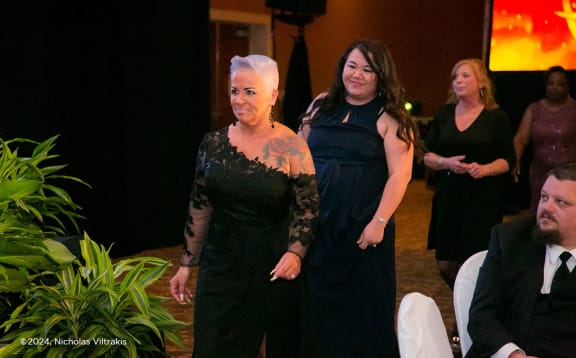 people walking down the aisle at a wedding ceremony