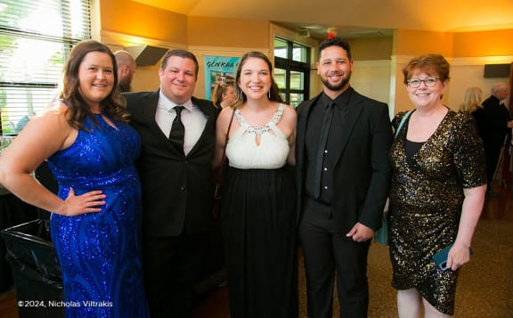 a group of people posing for a picture at a party