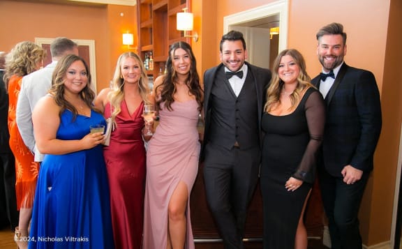 a group of people posing for a picture at a party