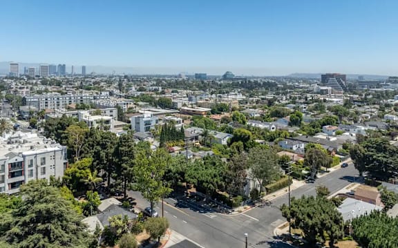 A cityscape with a clear blue sky above.
